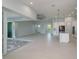 Open floor plan showcases a kitchen, living and dining area with seamless indoor-outdoor flow at 14526 Fort Worth Cir, Port Charlotte, FL 33981