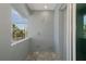 Screened-in patio features convenient outdoor shower area with privacy walls at 14526 Fort Worth Cir, Port Charlotte, FL 33981