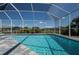 Beautiful screened-in pool with a sparkling, clean water view and outdoor recreational space at 14526 Fort Worth Cir, Port Charlotte, FL 33981