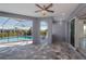 Open-air patio offering refreshing views of the pool and surrounding backyard at 14526 Fort Worth Cir, Port Charlotte, FL 33981