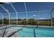 Inviting screened-in pool with relaxing water views, a peaceful backyard oasis for leisure activities at 14526 Fort Worth Cir, Port Charlotte, FL 33981