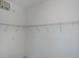 Spacious walk-in closet features wire shelving for optimal storage at 14526 Fort Worth Cir, Port Charlotte, FL 33981