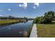 Waterfront property featuring a private dock and boat lift for easy access to the open water and waterfront living at 14526 Fort Worth Cir, Port Charlotte, FL 33981