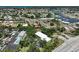 Wide aerial view showcasing the community's layout, nearby water access, and residential buildings at 149 Englewood Isles Pkwy # 609, Englewood, FL 34223