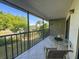 Relaxing balcony with seating, offering peaceful outdoor space and neighborhood views at 149 Englewood Isles Pkwy # 609, Englewood, FL 34223