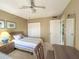 Cozy bedroom showcasing twin beds, closet, and natural light from the window at 149 Englewood Isles Pkwy # 609, Englewood, FL 34223