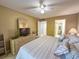 Bedroom featuring a TV and easy access to an ensuite bathroom at 149 Englewood Isles Pkwy # 609, Englewood, FL 34223