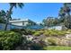 Attractive community entrance featuring lush landscaping and signage at 149 Englewood Isles Pkwy # 609, Englewood, FL 34223