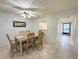 Light-filled dining area with tile floors, perfect for meals and entertaining guests at 149 Englewood Isles Pkwy # 609, Englewood, FL 34223