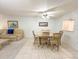 Open-plan living and dining area with comfortable seating and natural light at 149 Englewood Isles Pkwy # 609, Englewood, FL 34223