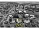 Aerial view of home and surrounding neighborhood, showcasing waterways at 1493 Kathleen Pl, Englewood, FL 34223