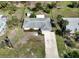 Aerial view of the property showcasing the lush surroundings and well-maintained yard at 1493 Kathleen Pl, Englewood, FL 34223