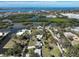Waterfront property aerial view displays the canal-lined community, beautiful blue waters and luscious greenery at 1493 Kathleen Pl, Englewood, FL 34223