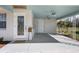 Inviting front porch featuring ceiling fans, a decorative door, and a 'Welcome' sign at 1493 Kathleen Pl, Englewood, FL 34223