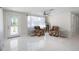 Inviting living room with bright white tile and lots of natural light at 1493 Kathleen Pl, Englewood, FL 34223