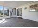 Screened in patio with brick floor and access to the back yard at 1493 Kathleen Pl, Englewood, FL 34223