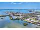 Aerial shot of a waterfront community with a bridge, open water views, and beautiful coastal scenery at 150 Crestview Dr, Englewood, FL 34223