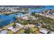 Aerial shot showcasing the condo near waterfront homes surrounded by lush greenery and a winding waterway at 150 Crestview Dr, Englewood, FL 34223