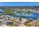 Aerial view highlighting the canals and waterways winding through the residential area surrounded by lush greenery at 150 Crestview Dr, Englewood, FL 34223