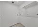 Minimalist bathroom featuring white walls, a sleek mirror, and clean lines, creating a modern aesthetic at 150 Crestview Dr, Englewood, FL 34223