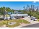 Beautiful single-story home with well-maintained lawn and partial water view from the front at 150 Crestview Dr, Englewood, FL 34223