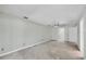 Bright living room featuring concrete flooring, ceiling fan, and multiple windows with great natural light exposure at 150 Crestview Dr, Englewood, FL 34223
