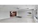 Open-concept living area, showcasing a kitchen with custom cabinetry, modern appliances, and a ceiling fan at 150 Crestview Dr, Englewood, FL 34223