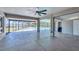 Spacious indoor-outdoor living area with screened enclosure leading to a pool and water views at 150 Crestview Dr, Englewood, FL 34223
