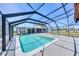 Enclosed pool area with tiki bar and ample deck space, great for entertaining and outdoor enjoyment at 150 Crestview Dr, Englewood, FL 34223