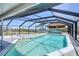 Inviting screened pool with a tiki bar offering a resort-style experience and beautiful outdoor views at 150 Crestview Dr, Englewood, FL 34223