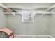 Functional storage space with built-in shelving and a window, providing organization and natural light at 150 Crestview Dr, Englewood, FL 34223