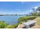 Scenic water view with bench, capturing the beauty of the serene waterfront at 150 Crestview Dr, Englewood, FL 34223