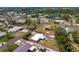Aerial view of the property, its surrounding greenery, and its proximity to local waterways at 1530 Philip Pl, Englewood, FL 34223