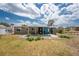 Backyard featuring a covered patio area perfect for entertaining and enjoying the outdoor space at 1530 Philip Pl, Englewood, FL 34223