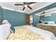 Comfortable bedroom with a ceiling fan, an entrance door, and mirrored closet doors at 1530 Philip Pl, Englewood, FL 34223