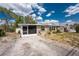 Charming home with a screened lanai, tidy landscaping and long driveway at 1530 Philip Pl, Englewood, FL 34223
