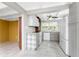 Modern kitchen with grey cabinetry, white appliances, and tiled backsplash at 1530 Philip Pl, Englewood, FL 34223
