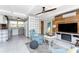 Open floor plan with cozy seating area leading to a modern kitchen space at 1530 Philip Pl, Englewood, FL 34223