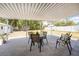 Spacious covered patio with seating, perfect for outdoor entertaining and relaxation at 1530 Philip Pl, Englewood, FL 34223