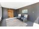 Cozy screened porch featuring comfortable seating, an outdoor bookcase, and a peaceful ambiance for relaxation at 1530 Philip Pl, Englewood, FL 34223