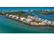 An aerial view of the buildings and lush greenery surrounded by blue waterways at 1551 Beach Rd # 207, Englewood, FL 34223