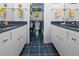 Bathroom features dual sinks and access to a walk in shower and toilet area at 1551 Beach Rd # 207, Englewood, FL 34223