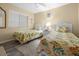 Bright bedroom with 2 twin beds offers great lighting and themed decor at 1551 Beach Rd # 207, Englewood, FL 34223