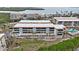 A multi-story building with a pool featuring balconies and proximity to waterways at 1551 Beach Rd # 207, Englewood, FL 34223