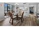 A cozy dining area with sliding glass doors leading to an outdoor seating area at 1551 Beach Rd # 207, Englewood, FL 34223