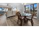 Dining room with seating for four and access to screened in patio that allows for views of the beach at 1551 Beach Rd # 207, Englewood, FL 34223