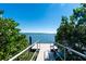 Waterfront dock surrounded by lush greenery providing tranquil access to the water at 1551 Beach Rd # 207, Englewood, FL 34223