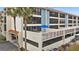 Condo exterior with a view of spacious private patios and garage parking underneath at 1551 Beach Rd # 207, Englewood, FL 34223
