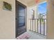 A sunny front door entrance, #207, with tasteful nautical themed accents at 1551 Beach Rd # 207, Englewood, FL 34223