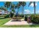 Outdoor grilling area with a picnic table, perfect for barbecues and social gatherings at 1551 Beach Rd # 207, Englewood, FL 34223